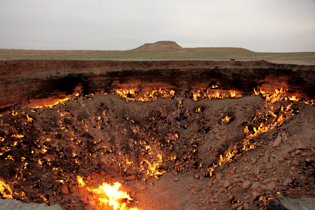 The Darvaza crater in daylight, a scorched bowl in the desert